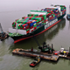 Cranes prepare to unload the Ever Forward ship.